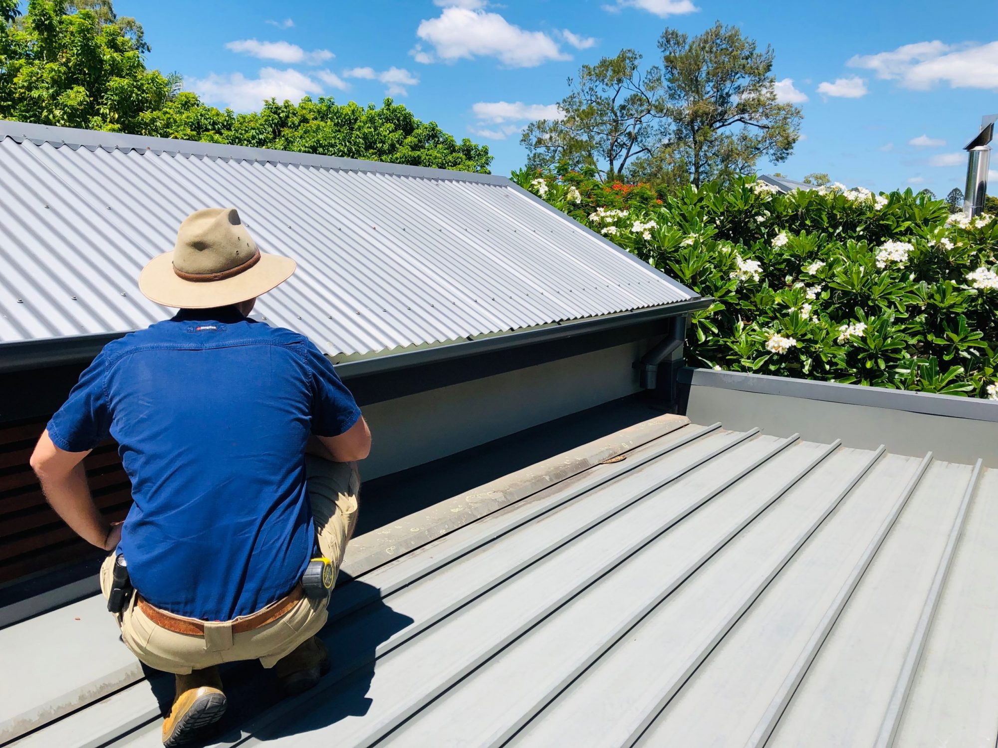 OneHome Building Inspector Inspecting a Metal roof