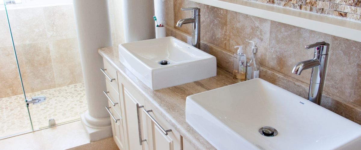 Plumber Taringa 9 Plumber installing sinks into kitchen inside Brisbane home
