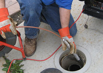 Brisbane plumber using CCTV camera to look down drain and unblock pipes