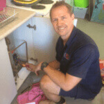 Morningside electrician inspecting power box before fixing electrical issues inside home