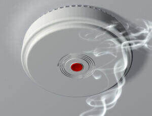 smoke alarm system being installed by electrician in Hawthorne