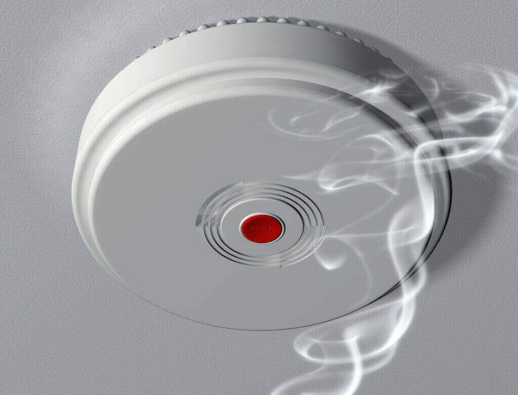 old smoke alarms being tested by local electrician based in Camp Hill