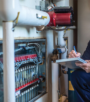 Electrician carrying out preventative maintenance checks