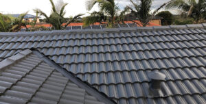 Roofer carrying out a roof inspection in Brisbane